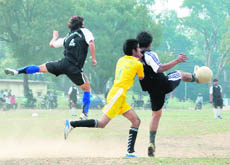    Players in action at the Narayan Gurung Memorial Football Tournament in Dehradun on Monday. 