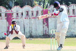    A batsman plays a shot at the Uttarakhand Technical University Tournament in Dehradun on Monday. 