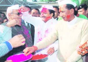 Chief Minister Ramesh Pokhriyal Nishank plays Holi with Assembly Speaker Harbans Kapoor and state BJP chief Bishan Singh Chuphal in Dehradun