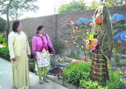 Monika Malik (right) shows her creations to principal Vijaya Tomar at CMK National PG College for Women in Sirsa. 