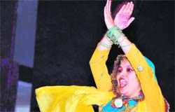 A student during the annual day celebations at her college with her hand scribbled with the song lyrics for memorisation.
