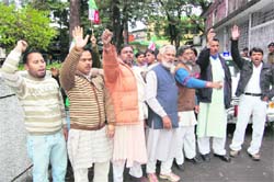 UKD workers hold a demonstration at the DMC office in Dehradun on Tuesday.