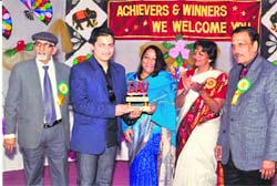 A student of Barmana DAV School being felicitated at