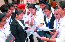 Students of the Department of Journalism and Mass Communication, Regional Centre, GND University, Jalandhar, share light moments after the seminar on Monday