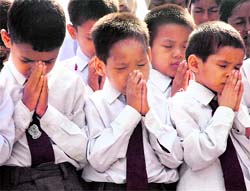 Schoolchildren pray to God ahead of their exams in Ludhiana