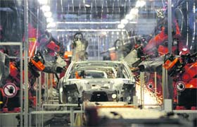This file picture shows robots working on a car body of a Porsche Panamera at German's car maker Volkswagen (VW) plant in Hanover, northern Germany. German activity stagnated in the fourth quarter of 2009, with statistics released on Wednesday confirming zero growth from October through December as consumers cut back and companies slashed inventories.