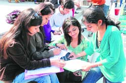 Students fill registration forms for the Job Fest 2010, organised at Government College, Sector 46, Chandigarh, on Wednesday. 