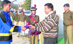Kumbh Mela DIG Alok Sharma gives away the prize to a winner at the inter-Kumbh volleyball tournament  in Haridwar