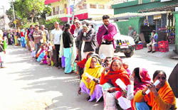 People wait at Chief Minister Ramesh Pokhriyal Nishanks Janta ka Darbaar programme in Dehradun 