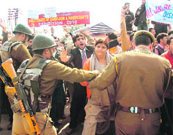All J&K ReT Teachers Forum members have a scuffle with the police in Jammu on Wednesday. 