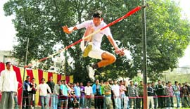 A student takes part in high jump during athletics meet at Arya College in Ludhiana 