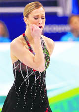 Canadas Joannie Rochette cries after her performance in the womens short programme figure skating event at the Vancouver 2010 Winter Olympics on Tuesday.