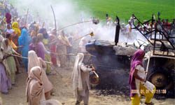 The agitating residents set a tractor on fire in Ferozepur