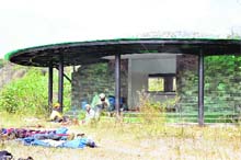 The canteen at the Tapkeshwar Mahadev Temple near Dehradun being used by beggars and sadhus.