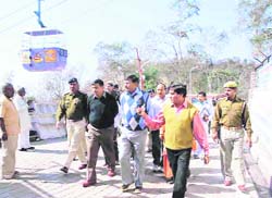 Mela officer Anand Vardhan and DIG (Mela) Alok Sharma inspect Mata Mansa Devi Temple area.