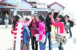 Students at Shishu Mandir play with colours during a Holi milan programme in Mussoorie on Thursday. 