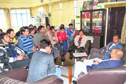 MPG College students interact with Forest Department officials in Mussoorie on Thursday.
