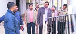 MDDA Secretary Sushil Kumar inspects land for a housing development scheme in Mussoorie on Thursday.