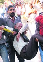 An injured worker being taken to hospital. 
