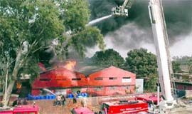 Fire brigade personnel try to extinguish the fire which broke out in a chemical factory at Industrial Area, Chandigarh, on Friday.