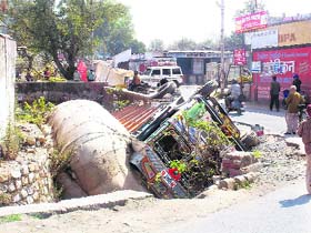 A truck overloaded with fodder turned turtle in Dehradun on Thursday.
