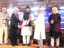 The national award for uplift of women through science and technology application being conferred on Dr Anil Joshi in New Delhi on Friday.