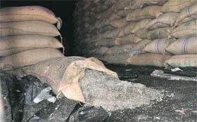 A bag of discoloured sugar in a godown at Jhabewal village in Ludhiana on Friday.