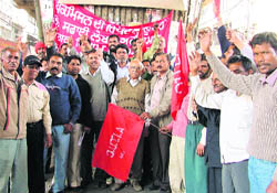 Activists of the Safai Labour Union and the Dr BR Ambedkar Welfare Mission hold a rally against rising prices in Ludhiana on Friday.