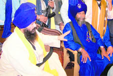  Baba Joginder Singh and Baba Balbir Singh, leaders of the two factions of the Nihang sect Baba Budha Dal, at Patiala Budha Dal Bagichi on Friday. 