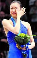 Gold medallist South Koreas Kim Yu-Na wipes her eye during the victory ceremony for the womens figure skating event at the Vancouver 2010 Winter Olympics on Friday