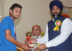 Finance minister Manpreet Badal giving away prize to a student during the annual prize distribution function at the Government Rajindra College in Bathinda 
