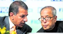 Finance Minister Pranab Mukherjee with newly elected president of Ficci Rajan Bharti Mittal at its 82nd Annual General Meeting in New Delhi on Saturday.