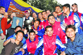 The Gorkha Brigade team receives the trophy after winning the Narayan Gurung Memorial Football Tournament 