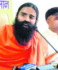 Yoga guru Ramdev addresses a press conference in Rohtak on Saturday.