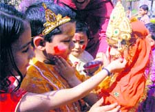 Children of Bal Niketan celebrate Holi at Ved Mandir at Ambhalla in Jammu on Saturday
