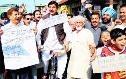 Members of the Jammu West Assembly Movement protest against the hike in prices of petrol and diesel in Jammu on Saturday