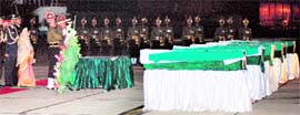 President Pratibha Patil pays last respects to those killed in the Kabul suicide attack, at the Palam airport in New Delhi on Saturday