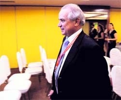 FIH president Leandro Negre walks past empty chairs prior to his conference in New Delhi on Saturday