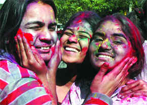 HOLI REVELLERY:  Girls celebrate Holi in New Delhi on Sunday. Tribune photos: Manas Ranjan Bhui