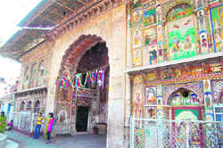 The main outer wall of the shrine having 17th century paintings that have been restored by the ASI.
