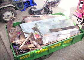 The material of an illegal structure lies on Mall Road in Mussoorie