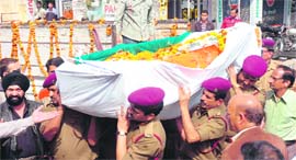 The body of PowerGrid DGM Bhola Ram Gupta being taken to the cremation ground in Jammu on Sunday.
