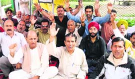 PoK refugees protest in front of the Divisional Commissioners office in Jammu on Sunday.