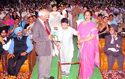 A physically challenged student being honoured during the annual prize distribution function of the Guru Nanak Khalsa College for Women, Gujarkhan campus, Ludhiana, on Sunday