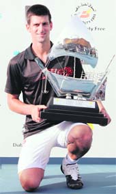 Novak Djokovic with the winners trophy after winning the final of the ATP Dubai Tennis Championships on Sunday.