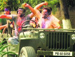 Students play Holi in Chandigarh on Monday.