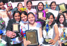 Students of the Dev Samaj College for Women, Sector 45, in a jubilant mood after receiving their awards during the annual prize distribution function in Chandigarh on Tuesday.