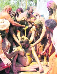 Juna Akhara sadhus play Holi in their own way in Haridwar