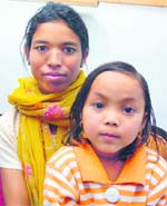 Monika, who was abandoned by her father in Jammu, being reunited with her mother.