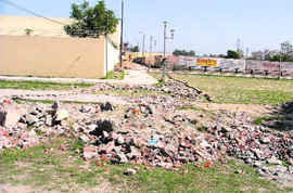 Residents of the Haibowal Khurd locality pulled down boundary wall in C Block of Rishi Valmiki Nagar to gain passage to the main road in Ludhiana on Sunday.